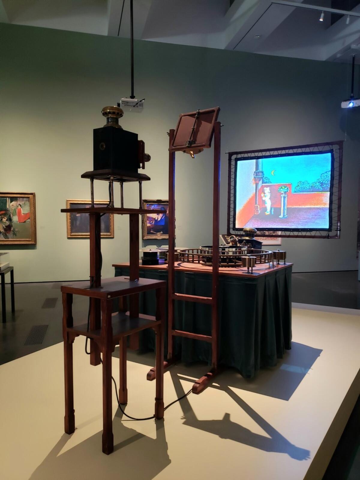 Emile Reynaud's early "optical theater" to project animations is seen in a 1972 reconstruction.