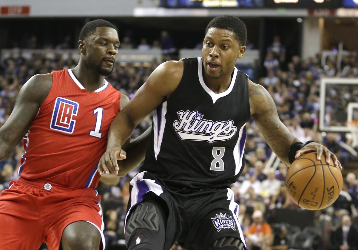 Kings forward Rudy Gay, right, drives against Clippers guard Lance Stephenson during the teams' 2015 season opener on Oct. 28 in Sacramento.