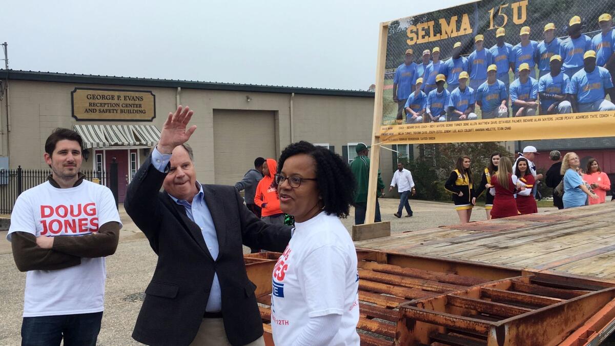 Then-candidate Doug Jones waves during a Christmas parade in Selma, Ala., on Dec. 2.