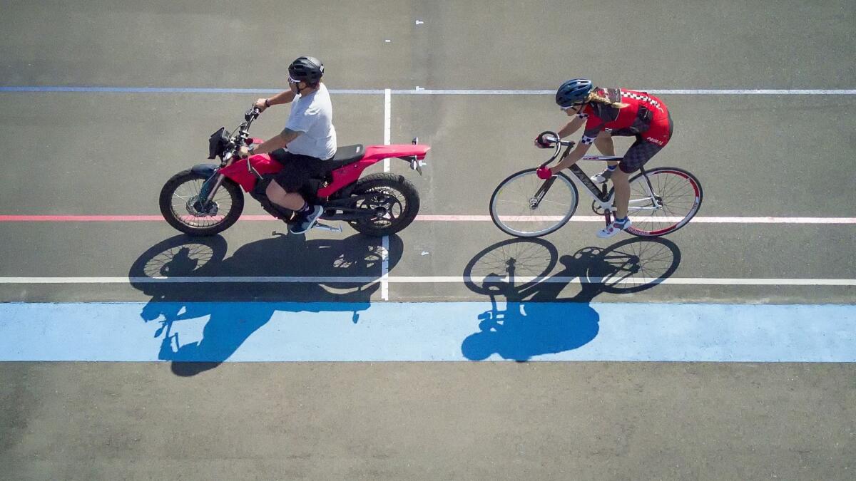 Training at the San Diego Velodrome for her attempt at the Men's Paced Bicycle Land Speed Record, Denise Mueller-Korenek paced behind cycling coach Matt Hoffmann during a recent training workout at the San Diego Velodrome.