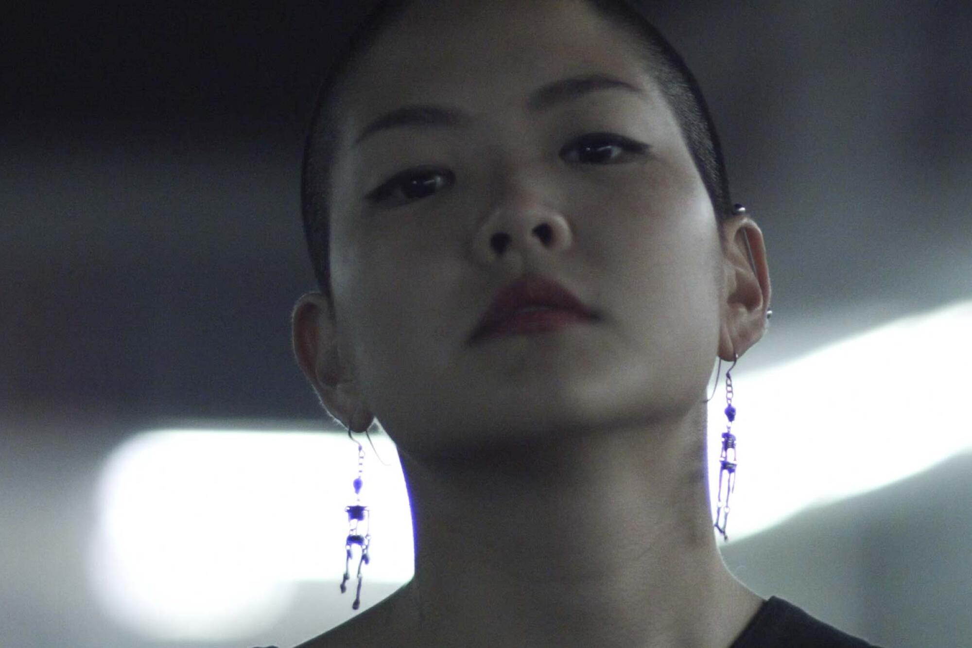 Kyoko Takenaka, in the short film "Home," looks directly into the camera.