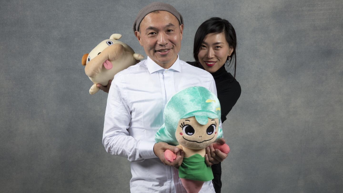 Japanese anime director Masaaki Yuasa, left, and producer Eunyoung Choi, from the film, "Lu Over the Wall," photographed in the L.A. Times Studio during the Sundance Film Festival in Park City, Utah, Jan. 20, 2018.