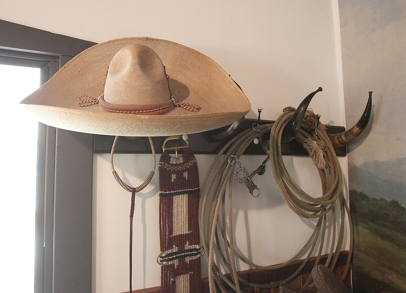 A room in the Serrano Adobe reflects the busy ranching days with a vaquero's hat and ropes at Heritage Hill Historical Park in Lake Forest.