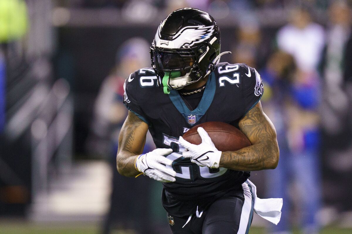 FILE - Philadelphia Eagles running back Miles Sanders (26) carries the ball during an NFL football game against the New York Giants, Sunday, Jan. 8, 2023, in Philadelphia. The Carolina Panthers have added two offensive weapons for their incoming rookie quarterback via free agency. The Panthers announced they have agreed to terms with running back Miles Sanders from the Philadelphia Eagles and tight end Hayden Hurst from the Cincinnati Bengals, Wednesday, March 15, 2023. (AP Photo/Chris Szagola, File)