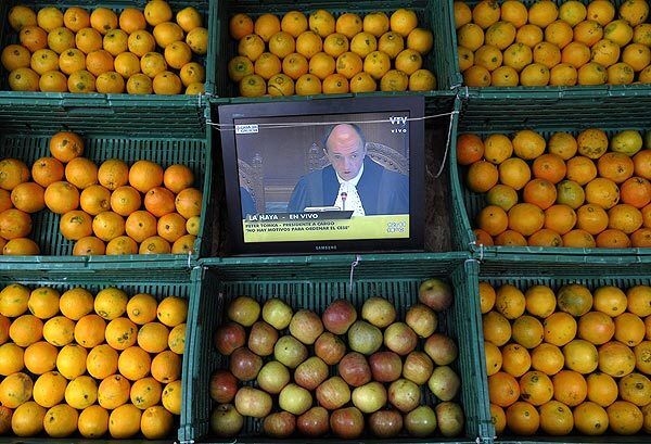 A television in a store in Uruguay's capital shows Judge Peter Tomka of the International Court of Justice in The Hague reading the judgment in a dispute between Argentina and Uruguay. The court ruled Uruguay did not breach its obligation to protect the environment by building a pulp mill on its side of a river that forms its border with Argentina.