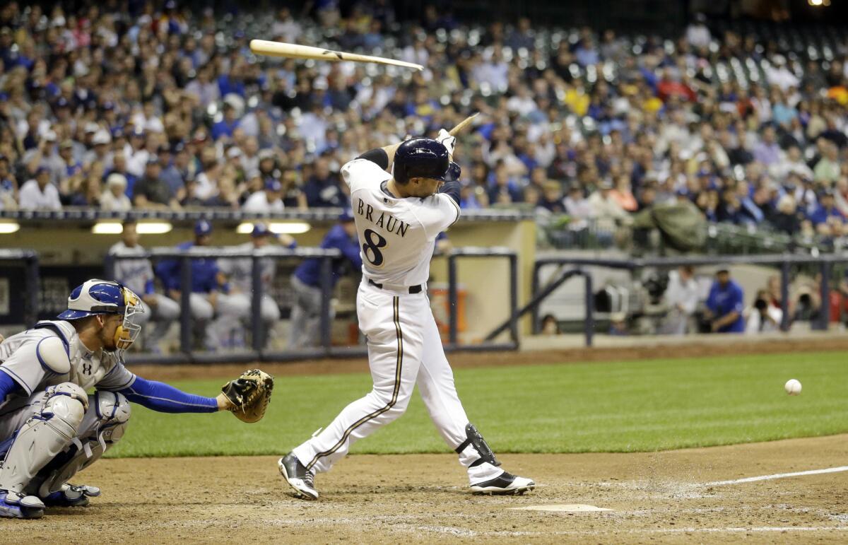 Brewers slugger Ryan Braun breaks his bat on an RBI infield single during the eighth inning of the Brewers' 4-3 win over the Dodgers.