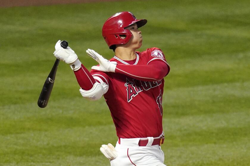Los Angeles Angels' Shohei Ohtani hits a three-run home run during the fourth inning of a baseball game against the Texas Rangers Tuesday, May 25, 2021, in Anaheim, Calif. (AP Photo/Mark J. Terrill)