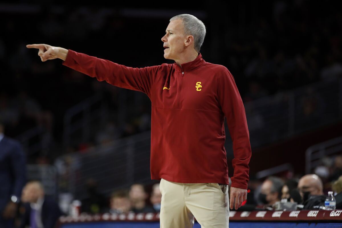 USC coach Andy Enfield instructs his players during a game against Arizona State on Jan. 24.