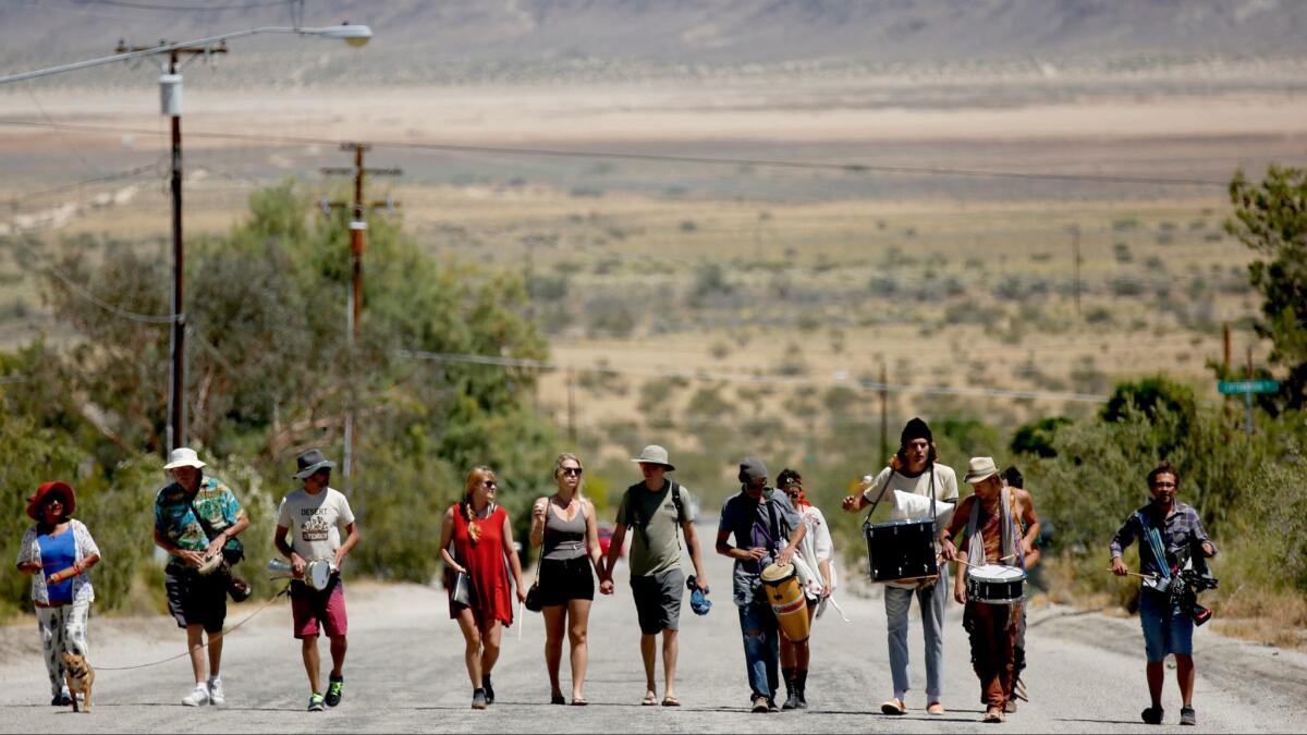 A procession leading to a 24-hour music marathon at Lou Harrison's house in Joshua Tree.