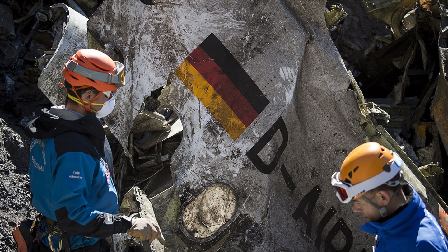 Gendarmes and rescuers from the Gendarmerie High-Mountain Rescue Group working at the crash site of the Germanwings Airbus A320 on March 31, 2015. The co-pilot who is believed to have deliberately crashed a Germanwings jet in the French Alps may have "rehearsed" steering the plane into a rapid descent on an earlier flight, German daily Bild reported on May 6, 2015.