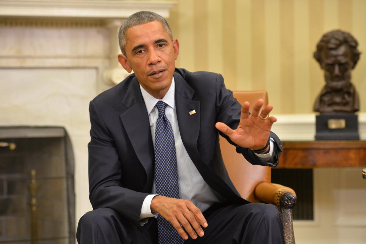 President Obama speaks about the fight against the Ebola virus during a meeting with his Ebola response team in the Oval Office at the White House on Thursday.