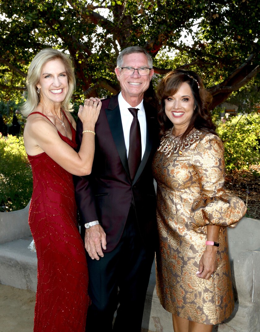 Kerry and Gavin Herbert Sr. with Mission San Juan executive director Mechelle Lawrence Adams.