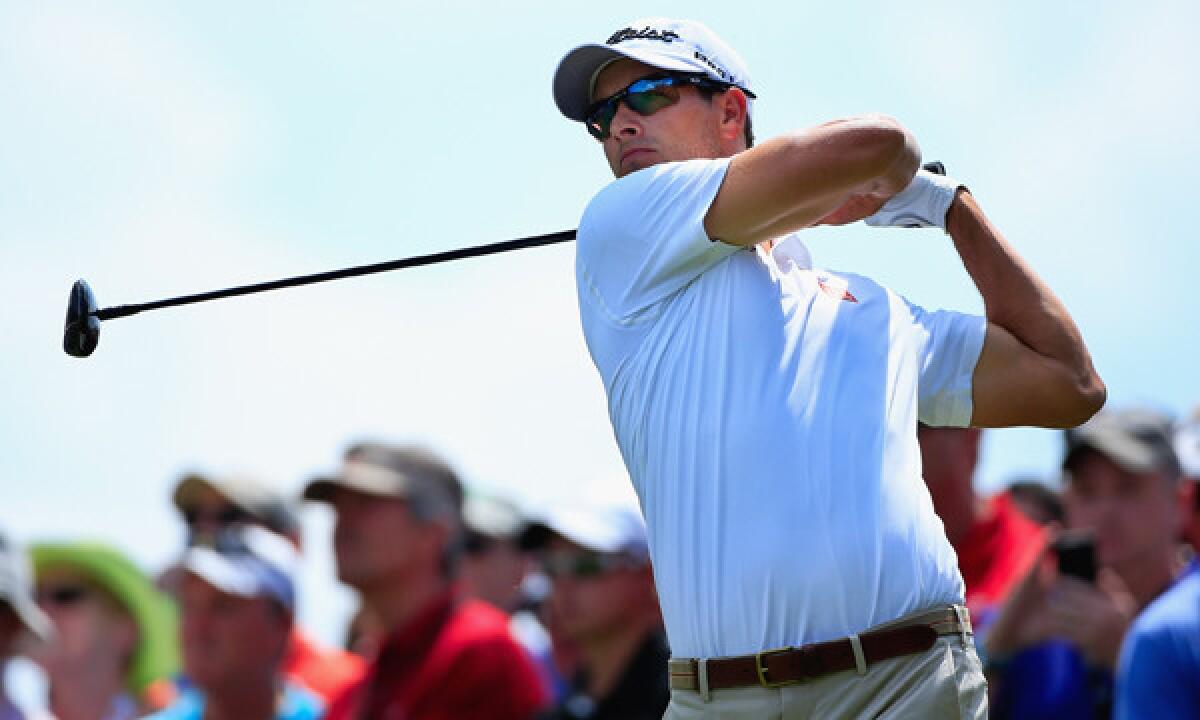 Adam Scott hits a tee shot on the third hole during the third round of the Arnold Palmer Invitational at Bay Hill Club in Orlando, Fla., on Saturday.