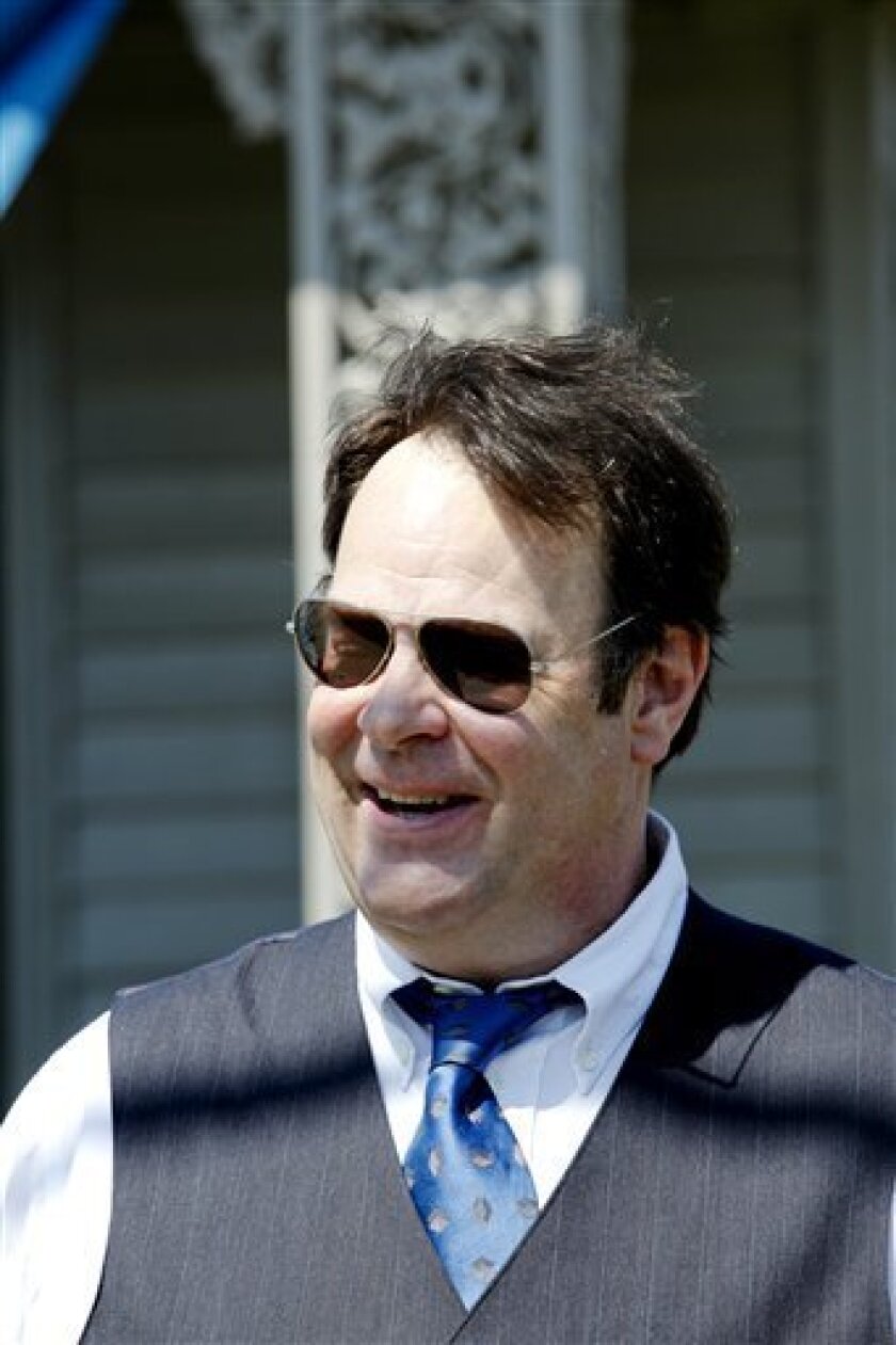 Actor Dan Aykroyd speaks to the media about the 21 storm-battered properties awarded to developers in New Orleans, on Wednesday, April 22, 2009. Aykroyd has lent his time and money to the Blue Line Foundation, one of the project's developers to rebuild the city after Hurricane Katrina. The developers plan to build homes for police officers, firefighters and other first responders. (AP Photo/Judi Bottoni)