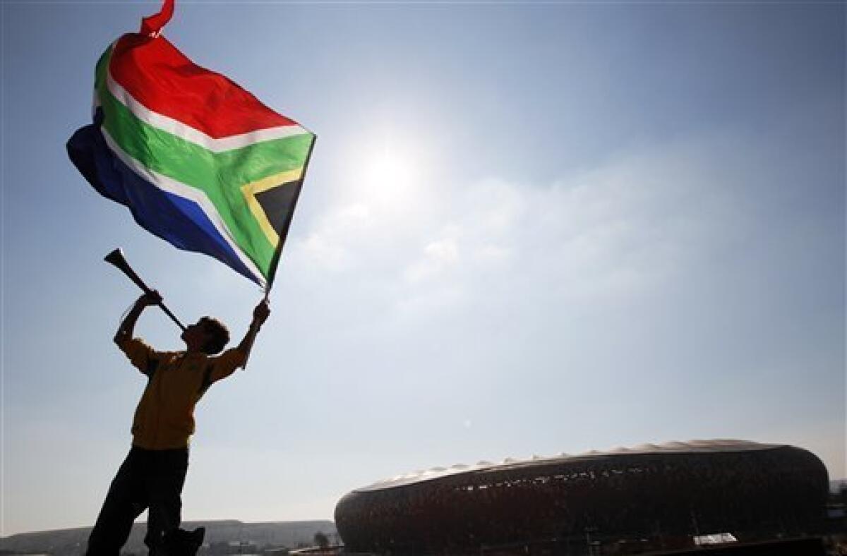 White South African man holds up a flag for the Afrikaner