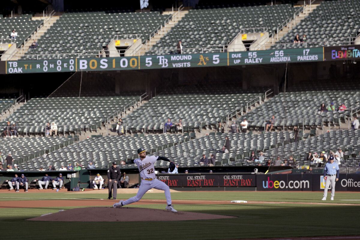 Oakland Athletics starting pitcher James Kaprielian throws against the Tampa Bay Rays in Oakland on June 12, 2023.