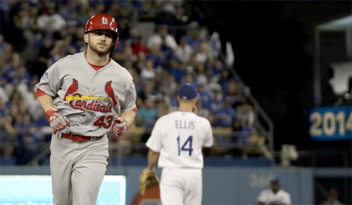 Shane Robinson rounds the bases after hitting a home run in the seventh inning off Dodgers reliever J.P. Howell during the Cardinals' 4-2 win over the Dodgers in Game 4 of the National League Championship Series.