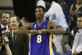 Kobe Bryant interacts with fans before a TV interview with Jim Gray.