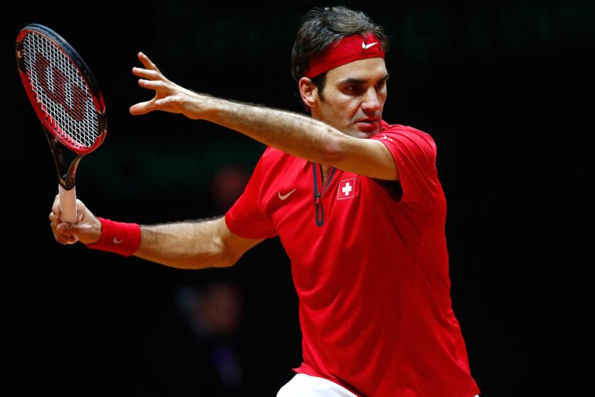 Roger Federer prepares to return a shot against Gael Monfils in their Davis Cup match on Friday.