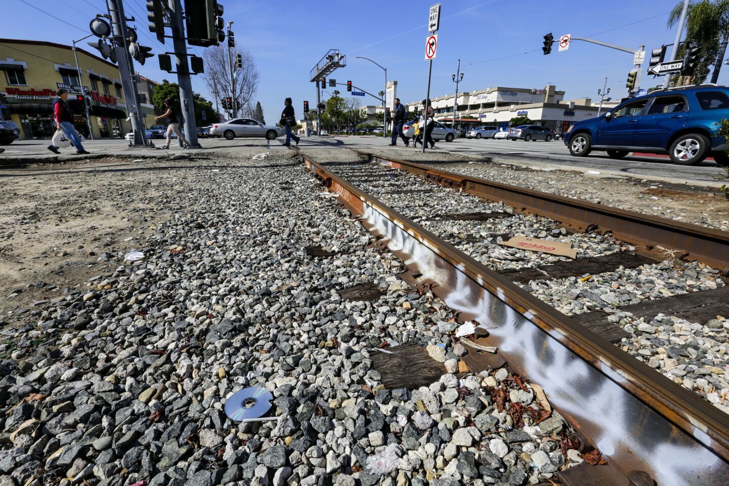 Graffiti is scrawled on the track crossing Pacific Boulevard at Randolph Street in Huntington Park.