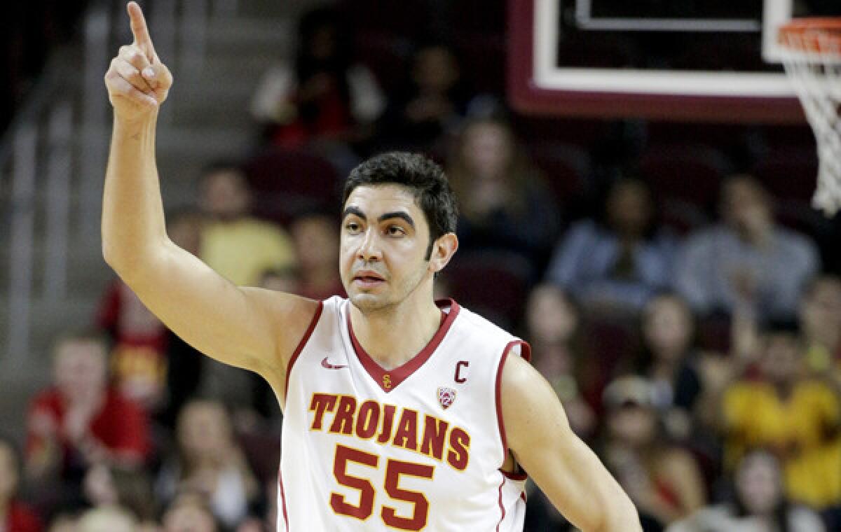 USC's Omar Oraby reacts after making a basket during the first half of Wednesday's game against visiting California.