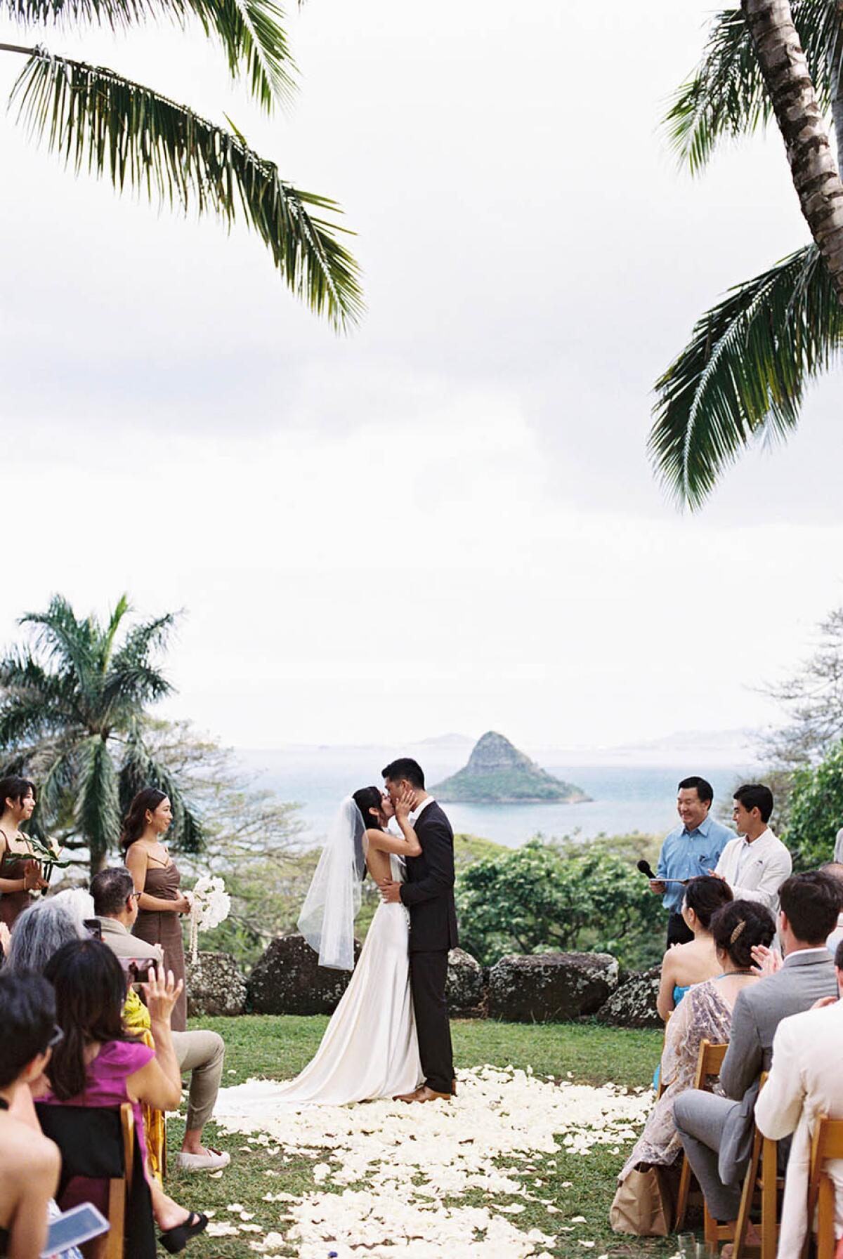 A couple gets married at Kualoa Ranch.