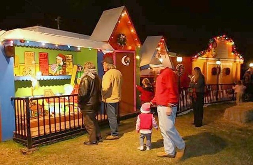 The "Snoopy House" Christmas display, pictured here, is being sent to Costa Mesa's City Hall since the home was foreclosed by Wells Fargo last week. The homeowner, Jim Jordan, has set up a trust that will financial aid in his lawsuit against the bank.