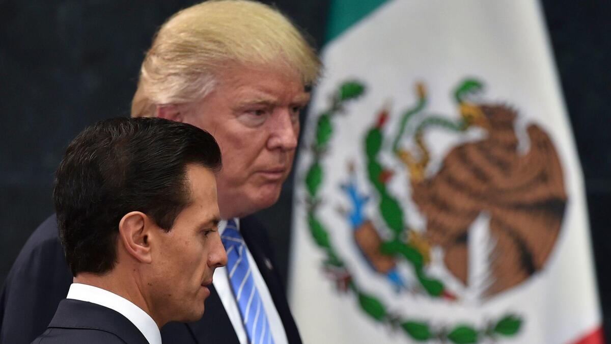 Mexican President Enrique Pe?a Nieto and then-Republican presidential nominee Donald Trump before a news conference in Mexico City in August.