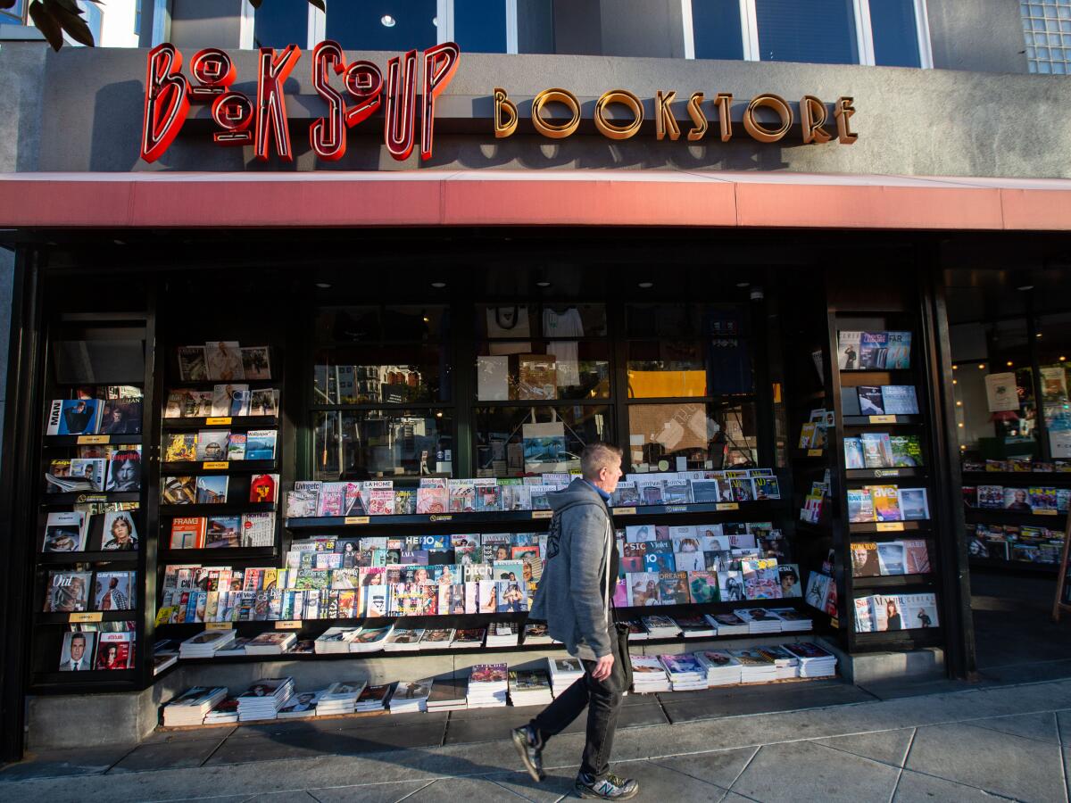 People walk past Book Soup Book Store