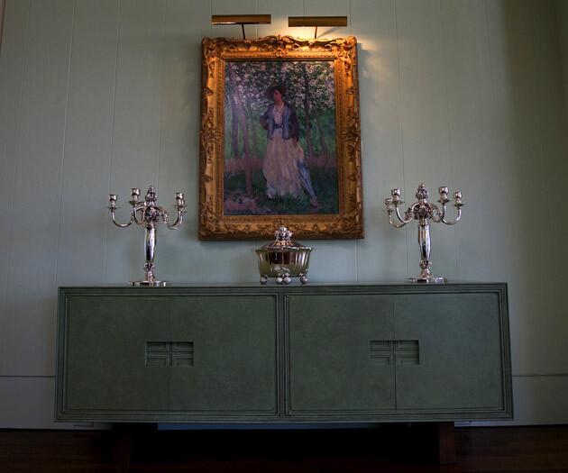 In addition to pink, green was a favorite color of Leonore Annenberg ¿ hence the celadon hues of the Haines and Graber hutch in the dining room. The Georg Jensen candelabra and tureen are from the 1920s and `30s.