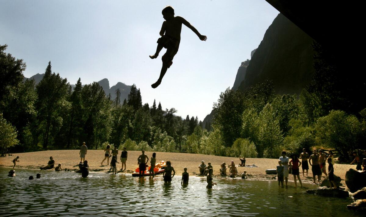 Rangers can fine visitors for jumping off Swinging Bridge into the Merced River in Yosemite National Park, but the water's lure proves powerful.