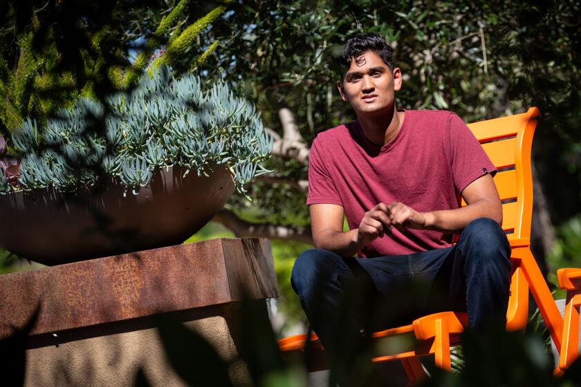 TUSTIN, CA - JULY 12: Janak Bhakta, 17, of Tustin poses for a portrait at his home on Sunday, July 12, 2020 in Tustin, CA. Bhakta is taking a Gap Year during the coronavirus pandemic and will be traveling around to different national parks to assist in conservation projects. (Jason Armond / Los Angeles Times)