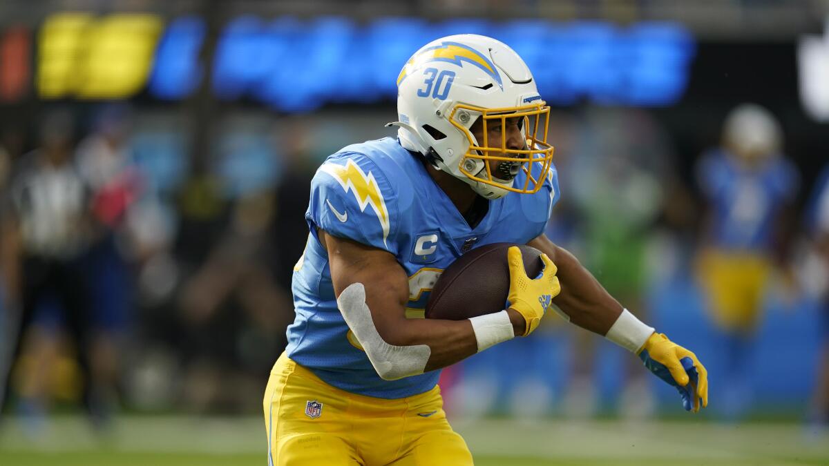 Los Angeles Chargers running back Austin Ekeler (30) runs the ball during the first half.
