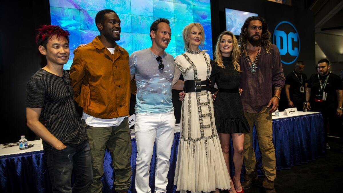 The cast of "Aquaman," from left, director James Wan and actors Yahya Abdul-Mateen II, Patrick Wilson, Nicole Kidman, Amber Heard and Jason Momoa pose before an autograph session at 2018 San Diego Comic-Con International.