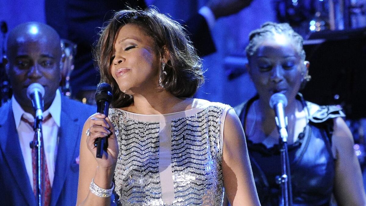 Whitney Houston performs at the pre-Grammy gala and salute to industry icons with Clive Davis honoring David Geffen in Beverly Hills on Feb. 13, 2011