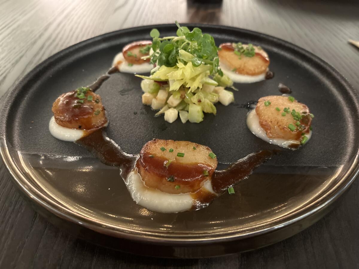 Pan-seared scallops at Hell's Kitchen restaurant at Harra's Resort Southern California in Valley Center.