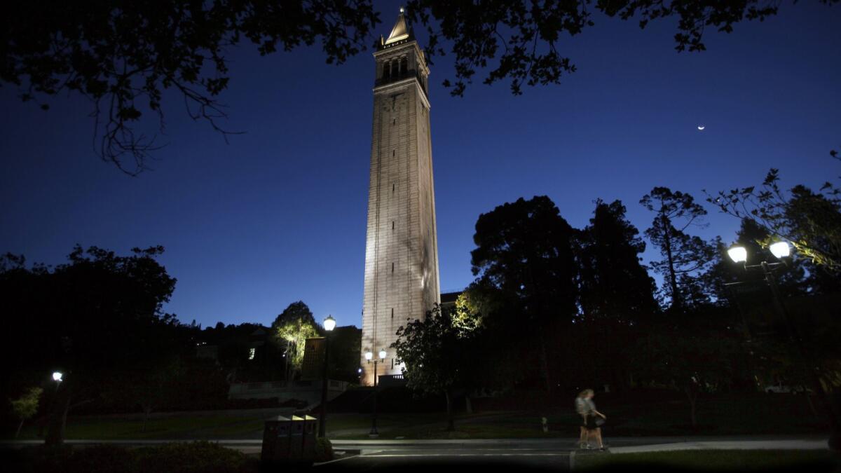 Early morning joggers pass the Campanile on UC Berkeley's campus in Berkeley, Calif. on Sept. 9, 2015.
