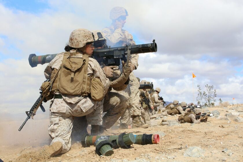Sgt. Emma Bringas, serving as assistant gunner and anti-tank missileman, and Lance Cpl. Terrence Lay fire an MK153 shoulder-launched multipurpose assault weapon (SMAW) at Twentynine Palms in March, during combat trials with the Ground Combat Element Integrated Task Force. (U.S. Marine Corps photo by Sgt. Alicia R. Leaders/Released)