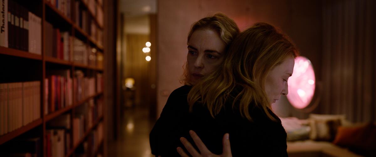 Two women embrace in the movie "Tár."