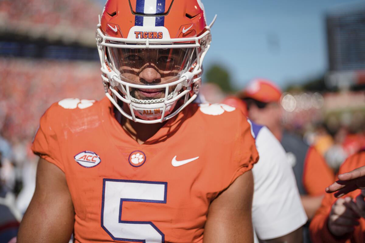 Clemson quarterback DJ Uiagalelei (5) walks off the field after an NCAA college football game against Syracuse on Saturday, Oct. 22, 2022, in Clemson, S.C. (AP Photo/Jacob Kupferman)