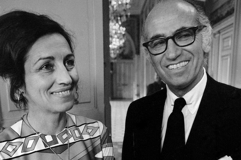 Dr. Jonas Salk, developer of the polio vaccine, and Francoise Gilot, former mistress of painter Pablo Picasso, are seen following their civil wedding at Paris Neuilly Town Hall, June 30, 1970. (AP Photo/Laurent Rebours)