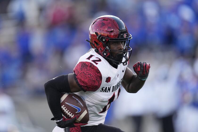 San Diego State cornerback Dallas Branch runs for a short gain after intercepting apass against Air Force in the first half of an NCAA college football game Saturday, Oct. 23, 2021, at Air Force Academy, Colo. (AP Photo/David Zalubowski)