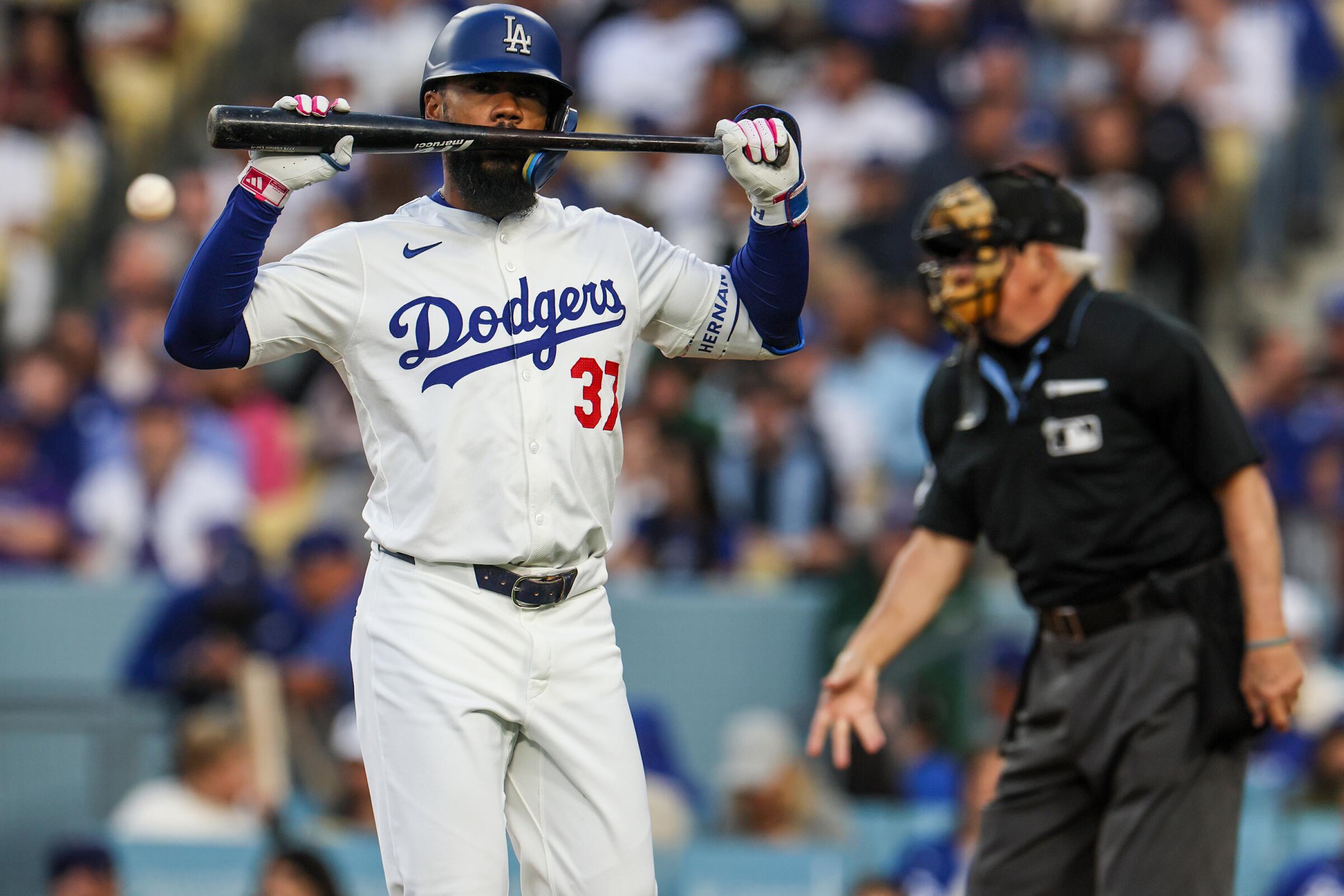 Dodgers outfielder Teoscar Hernández reacts after striking out against the Rockies.