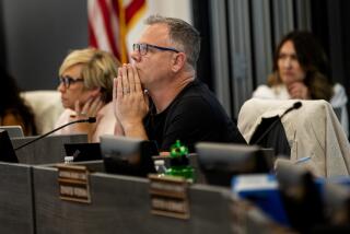 TEMECULA, CA - JULY 18, 2023: School Board President Joseph Komrosky listens during a contentious special meeting about textbook on July 18, 2023 in Temecula, California. The conservative majority on the school board is at the center of a debate with Gov. Gavin Newsom who has threatened to fine the board over $1 million because of their resistance to include a lesson involving Harvey Milk.(Gina Ferazzi / Los Angeles Times)