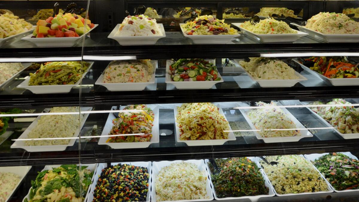 A large selection of fresh salads are offered at the new Irvine Ranch Market on Balboa Island on Wednesday.