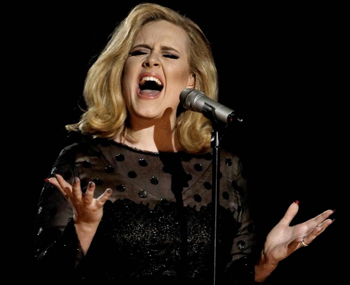 Adele, shown performing at the 2012 Grammy Awards in Los Angeles, tweeted to fans that she will soon be releasing her third album, which she has titled "25."