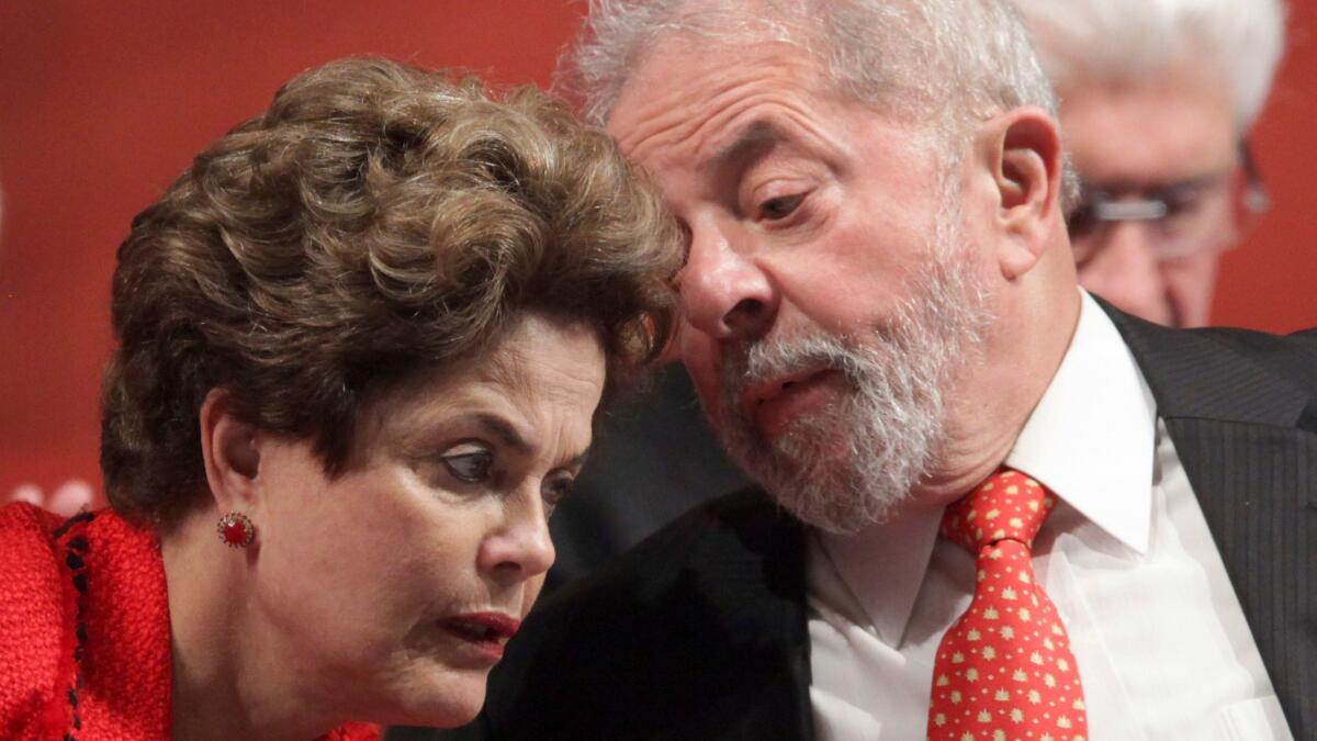 Former Brazilian President Luiz Inacio Lula da Silva, right, and his ousted successor, Dilma Rousseff in July.