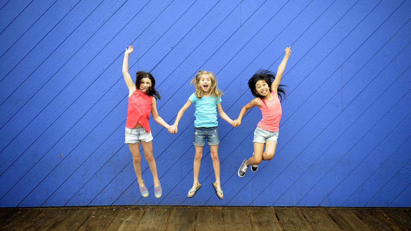 The three Matildas: Mia Sinclair Jenness, left, Mabel Tyler and Gabby Gutierrez are photographed during a day at Santa Monica Pier.