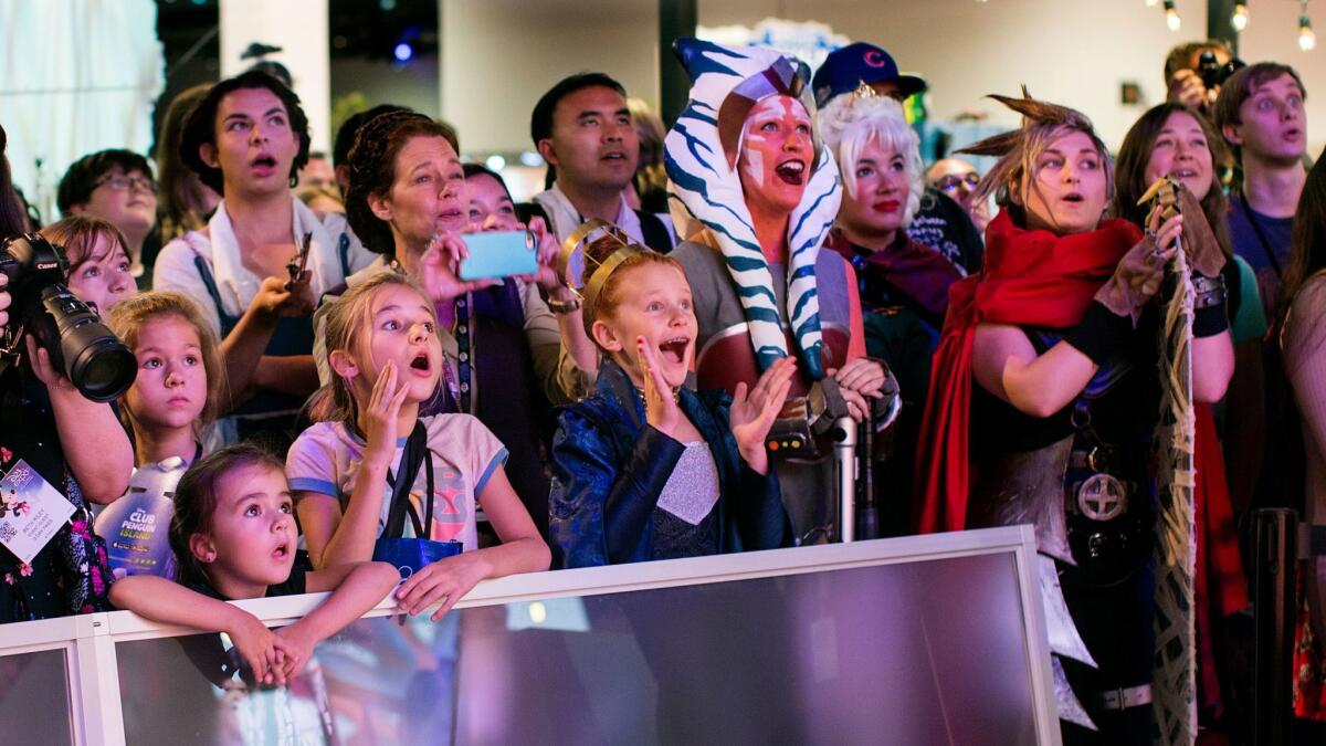 A crowd watches a fashion show at a Disney event in Anaheim, which saw a record 24.2 million visitors last year.