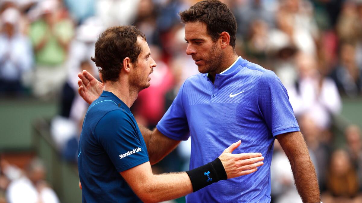 Andy Murray, left, and Juan Martin del Potro greet one another after their third-round match at the French Open on Saturday.